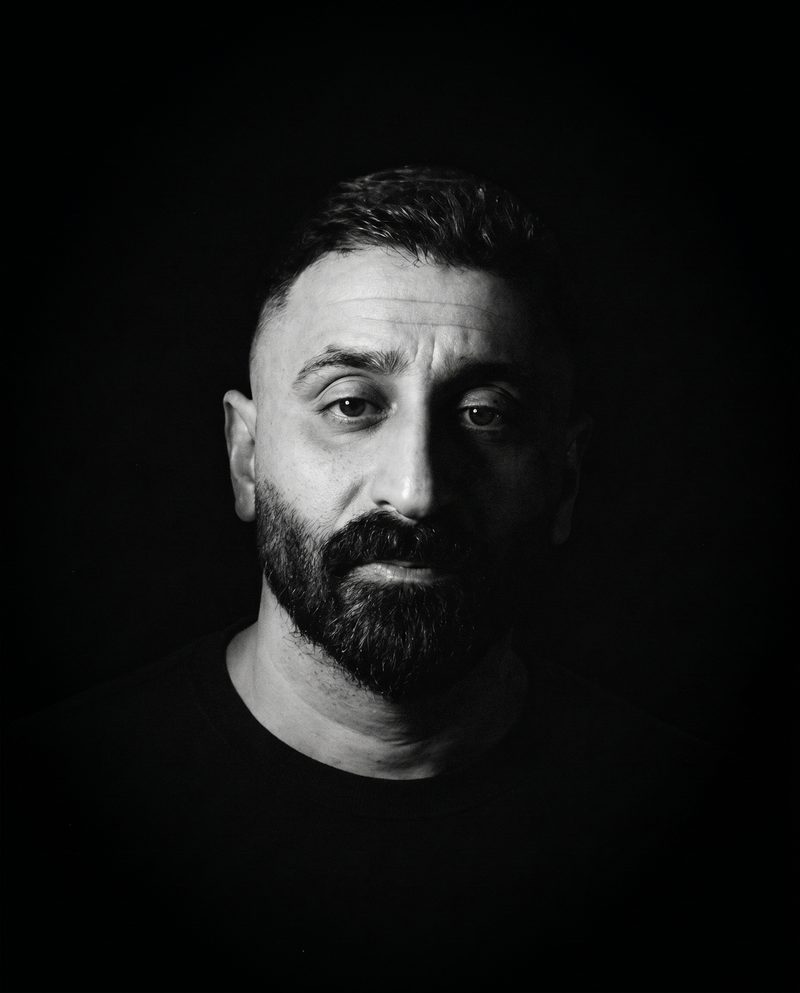 Black and white portrait of Mo Naboulsi, writer, philosopher, and strategist